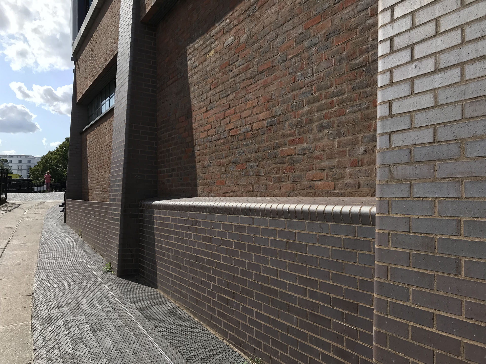 Brown brindle facing bricks and bullnose bricks create seating along the wall at Hawley Wharf